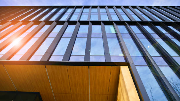 istock Glass modern building with blue sky background. Low angle view and architecture details. 1493905811