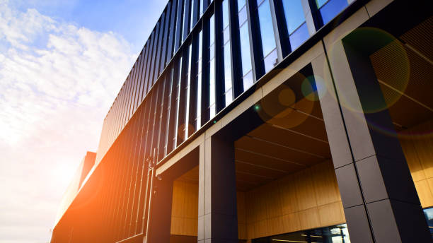 istock Glass modern building with blue sky background. Low angle view and architecture details. 1493905872