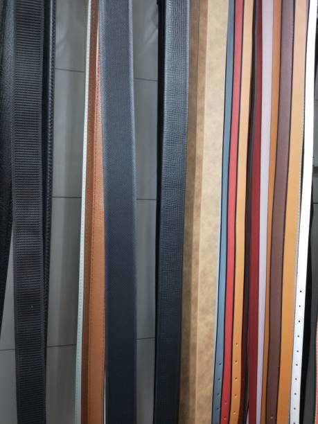 istock a line of hanging belts, ready to be sold 1493906834