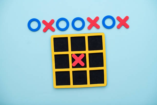 istock A game of tic tac toe. Concept XO Win Challenge. Developmental game for children. Flat lay, top view. Business marketing strategy planning concept. 1493909587