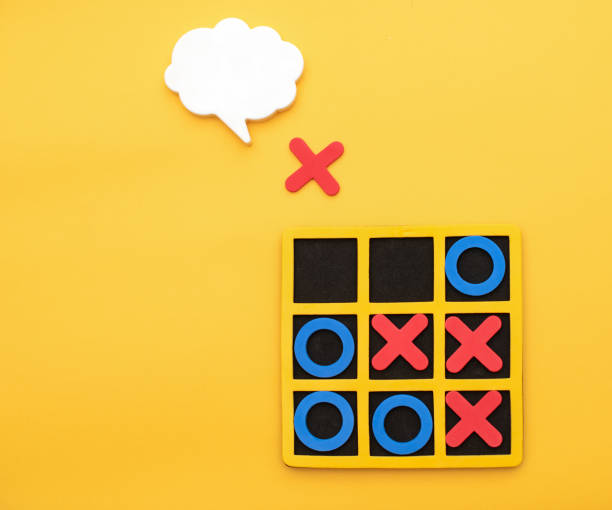 istock A game of tic tac toe. Concept XO Win Challenge. Developmental game for children. Flat lay, top view. Business marketing strategy planning concept. 1493909647