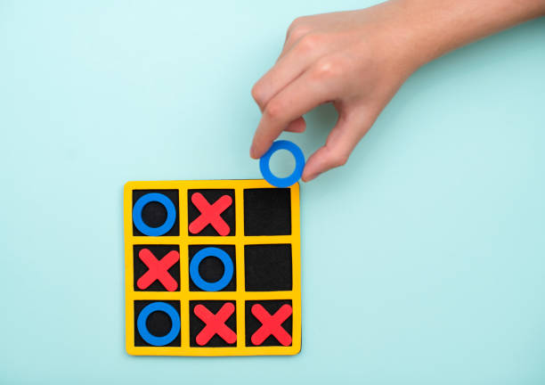 A game of tic tac toe. Concept XO Win Challenge. Developmental game for children. Flat lay, top view. Business marketing strategy planning concept. stock photo