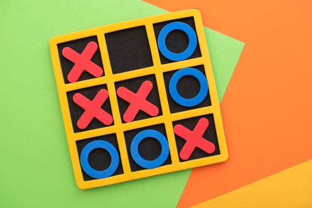 A game of tic tac toe. Concept XO Win Challenge. Developmental game for children. Flat lay, top view. Business marketing strategy planning concept. stock photo