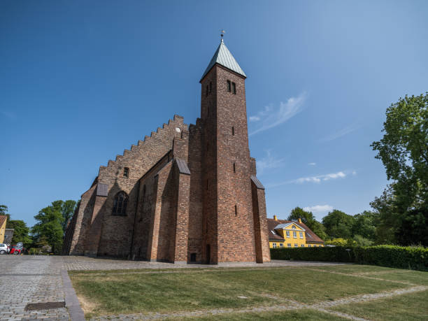 Fjenneslev medieval parish church on Zealand has a central position in the history of Denmark. The myth tells, that Asser Rig, a noble man, had to leave his pregnant wife to go to war. They made the deal, that if she gave birth to a boy, she should build a tower, and if she gave birth to a girl a spire. Asser Rig came home to a church with a double tower representing the boys Absalon and Esbern Snare. 