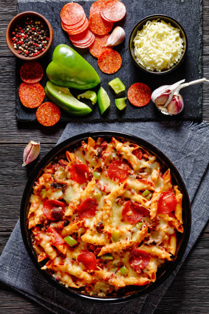 istock Pizza Casserole of pasta, beef, pepperoni, cheese 1493918340