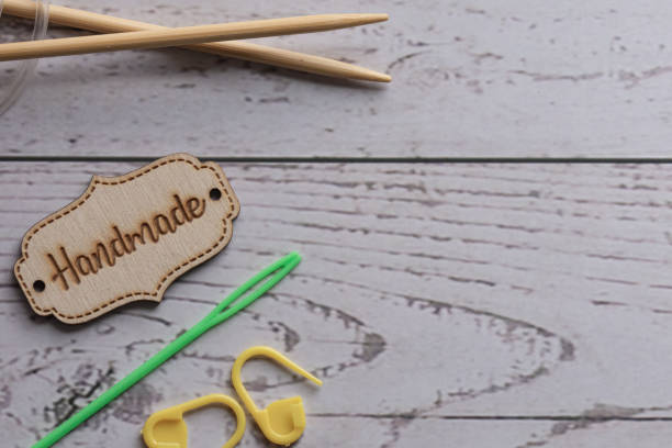 knitting supplies on white wooden background