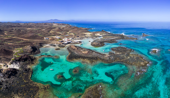 Aerial view of Puertito village and the beautiful natural pools  lagoons of the island of Lobos near Corralejo in Fuerteventura Spain