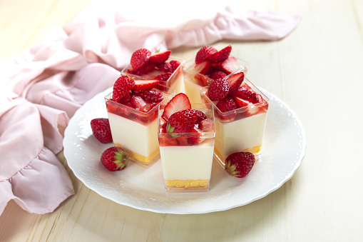 Strawberry dessert - cheesecake with strawberry jelly in the glass