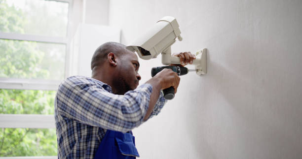 istock Close-up Of Technician Adjusting CCTV Camera 1493925531