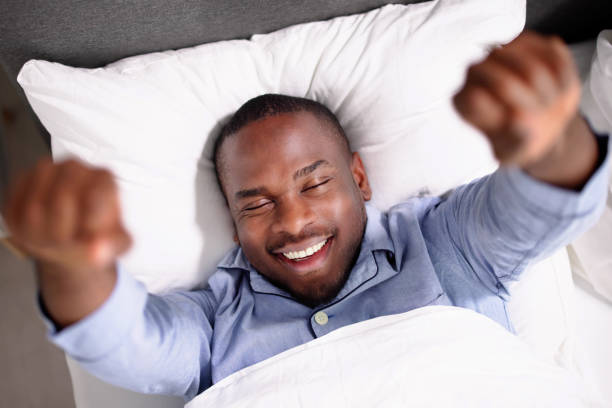 istock Young Happy Smiling African Man Waking Up 1493925845
