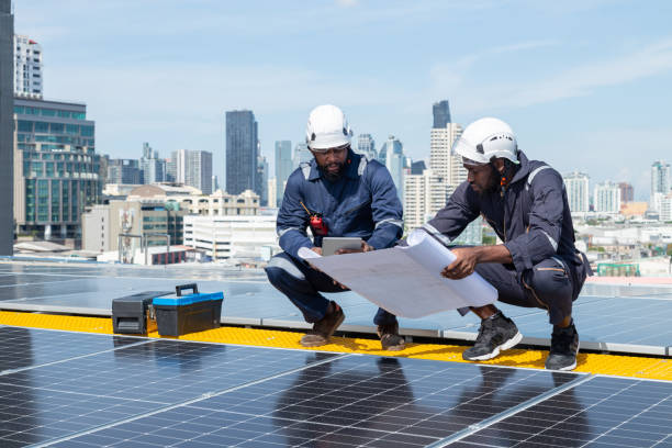 istock Engineers and technicians check drawings for installing solar cell panels on the roof. 1493926106