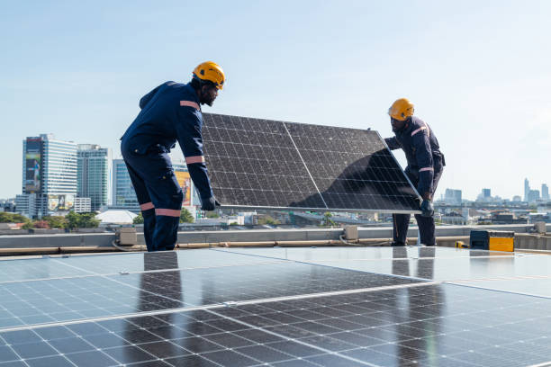 istock Engineers and technicians check drawings for installing solar cell panels on the roof. 1493927671