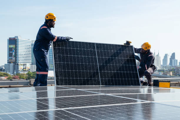 istock Engineers and technicians check drawings for installing solar cell panels on the roof. 1493927885