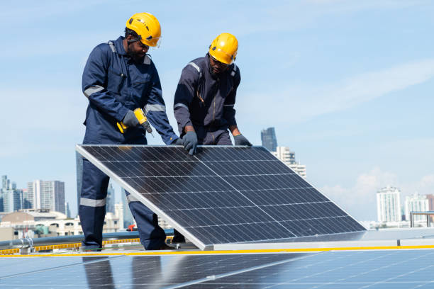 istock Engineers and technicians check drawings for installing solar cell panels on the roof. 1493927986