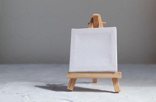 Easel for drawing on. gray background with copy space. drawing concept