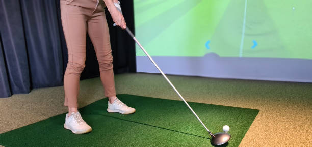 istock Girl golf player plays golf indoors closeup 1493930896