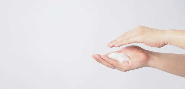 istock Hands washing gesture and foam hand soap on white background. 1493934729