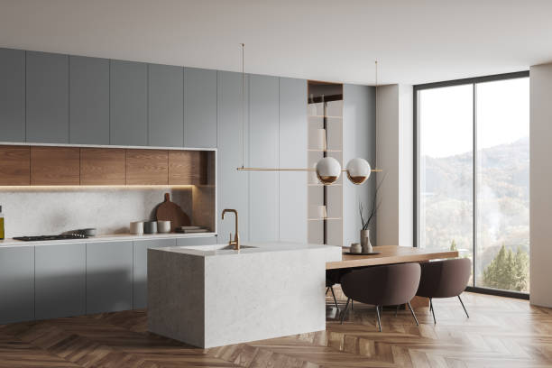 istock Cozy home kitchen interior with cooking and dining area, panoramic window 1493935296