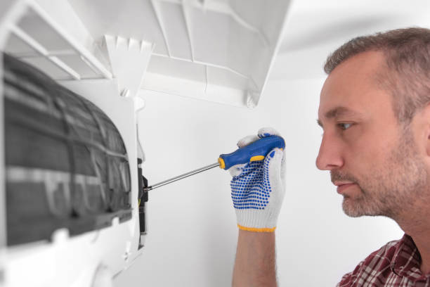 istock Service guy cleaning and maintaining air condition unit. 1493936332