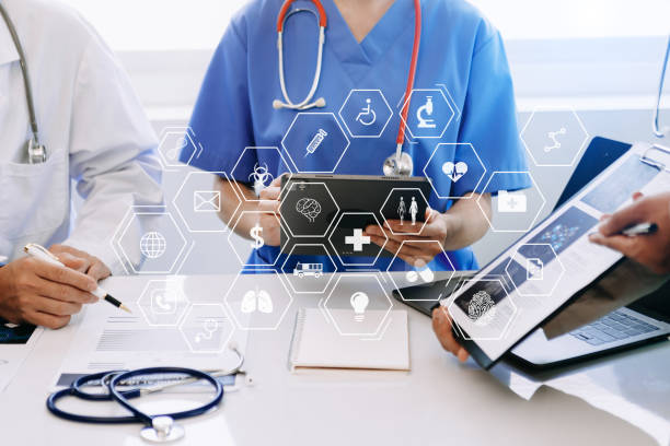istock Medical technology network team meeting concept. Doctor hand working with smart phone modern digital tablet and laptop computer with graphics chart interface, with virtual icon 1493936729