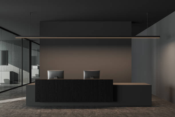 Grey reception interior desk with two computers and business company hallway