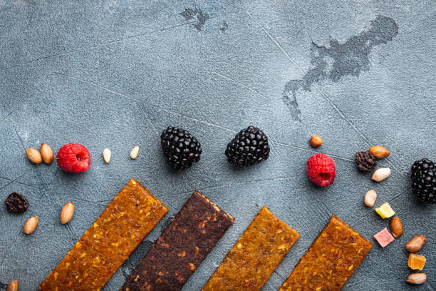 istock Dried fruits bars, top view with copy space, on grey background 1493937064