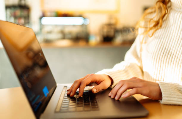 istock Female hands working on a laptop, close-up. Business, technology, internet and networking concept. 1493937481
