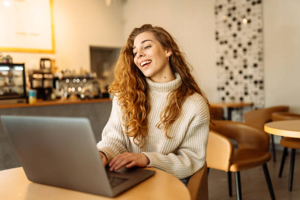 istock Young woman with laptop at home. 1493938502