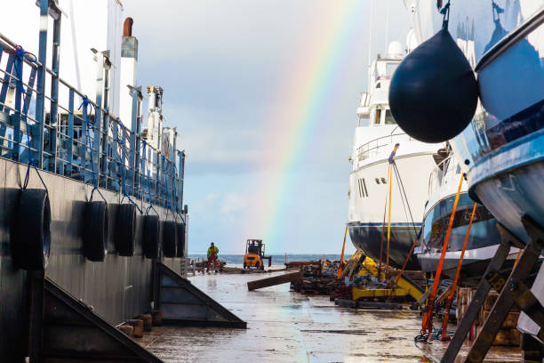 transportation of yachts and small vessels across the ocean using a heavy vessel. - repairing sky luxury boat deck imagens e fotografias de stock