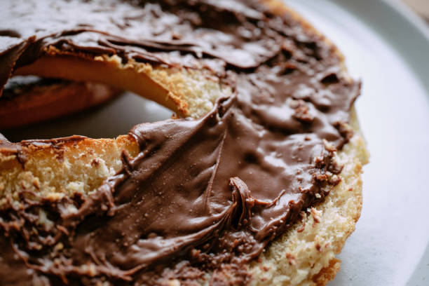 Toasted white bagel covered in Chocolate and hazelnut spread.