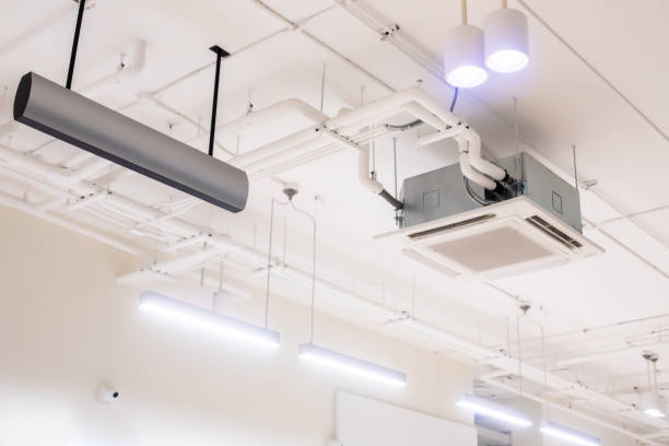 istock Selective focus to ceiling mounted cassette type air condition units with other parts of ventilation system. 1493943925