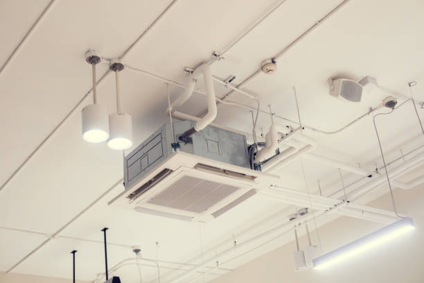 istock Selective focus to ceiling mounted cassette type air condition units with other parts of ventilation system. 1493943928