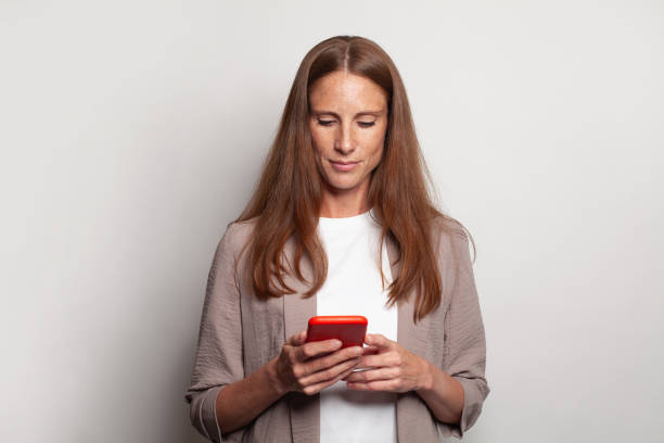 Perfect woman using phone on white background