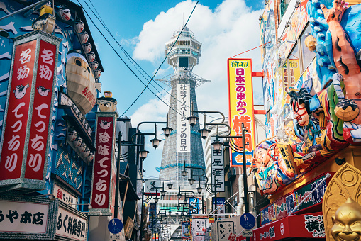 Osaka's Tsutenkaku Tower in Japan, with its vibrant and colorful signs, has seen a resurgence of tourist crowds after the COVID-19 pandemic. This photo was taken on April 17, 2023.