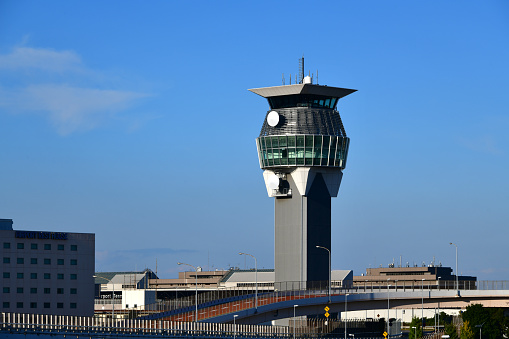 Narita, Chiba prefecture, Tokyo, Japan: ramp central control tower at Narita International Airport (NRT) aka Tokyo-Narita - the tower has an earthquake-resistant structure for the tower body and a base-isolated structure for the upper floors - contains a control room, a training room, and a briefing room - Japan Air Navigation Service (JANS), the service provision branch of Civil Aviation Bureau of Japan (JCAB), Fukuoka Flight Information Region (FIR). At the bottom the viaducts of terminal 1.