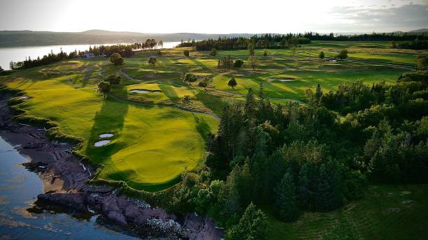 istock a green golf course overlooking a river on a sunny day 1493951438