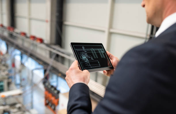 istock Male Engineer Supervising The Production Process From Above 1493952761