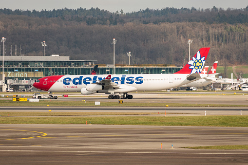 Zurich, Switzerland, January 20,2023 Edelweiss Airbus A340-313 aircraft is taxiing to its position