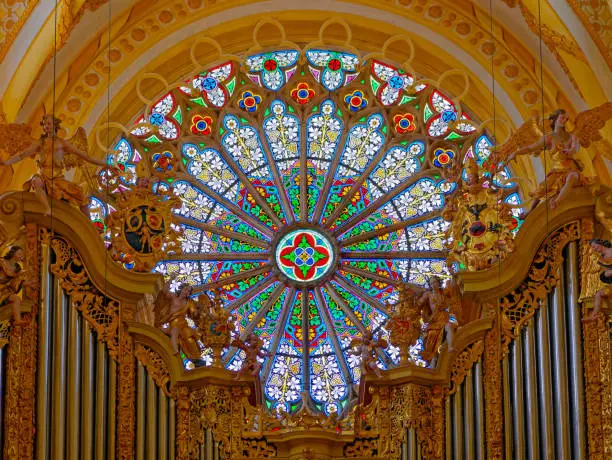 rose window and baroque organ in monastery of Ebern, Germany