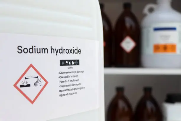 Photo of sodium hydroxide, Hazardous chemicals and symbols on containers