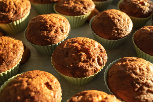 istock Homemade muffins on a tray in silicone molds. 1493955004