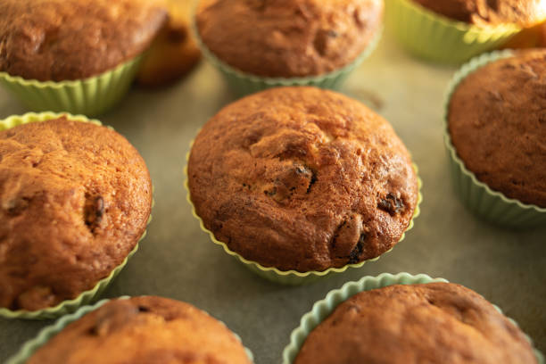 istock Homemade muffins on a tray in silicone molds. 1493955041