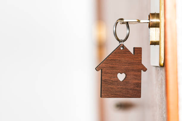 Key ring hanging from a key on a door