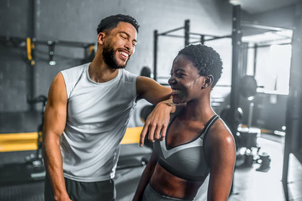 istock Multiracial young couple laughing in gym 1493959985
