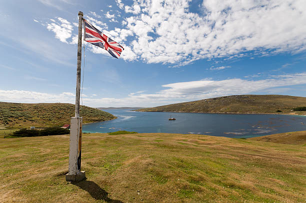 A royalty free stock photo of a Cow Green reservoir surrounded by bleak fells in the wilderness of northern England.-