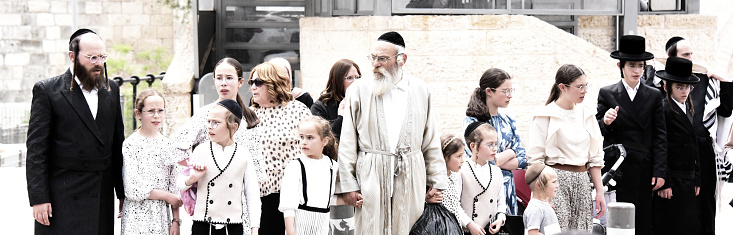 Jerusalem, The Old City -May 27, 2023: Religious Jewish family goes to East Jerusalem.