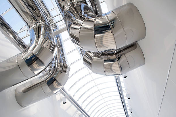 Air Conditioning Ducts Air conditioning ducts of a modern building. piping hot stock pictures, royalty-free photos & images