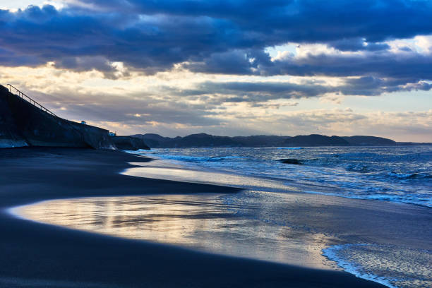 istock Scenic view of beach against dramtic sky during sunrise 1493963006