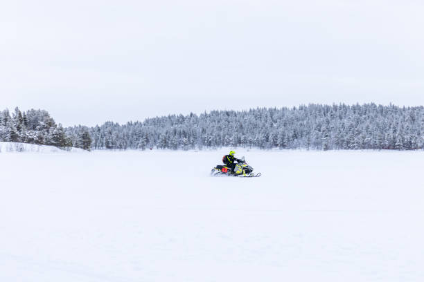 istock Snowmobile riding on a frozen lake 1493963617