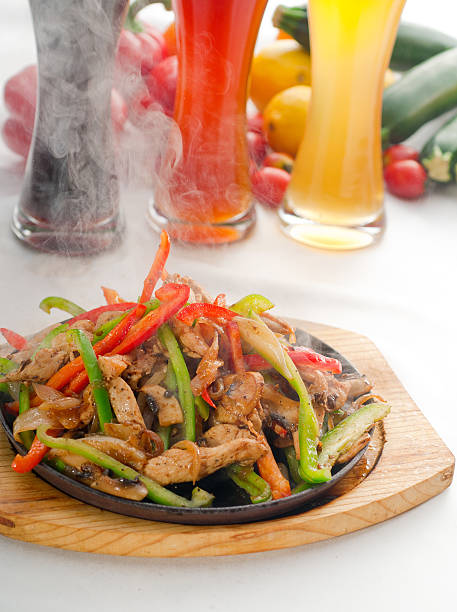 istock original fajita sizzling hot  on iron plate 149396530